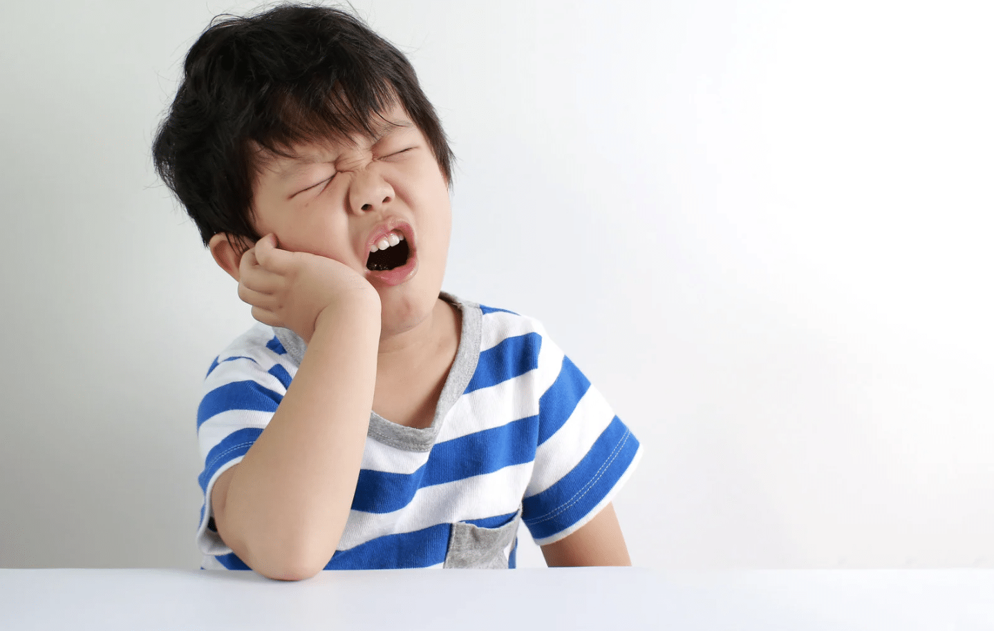 Quels sont les signes d'une infection dentaire chez l'enfant ?